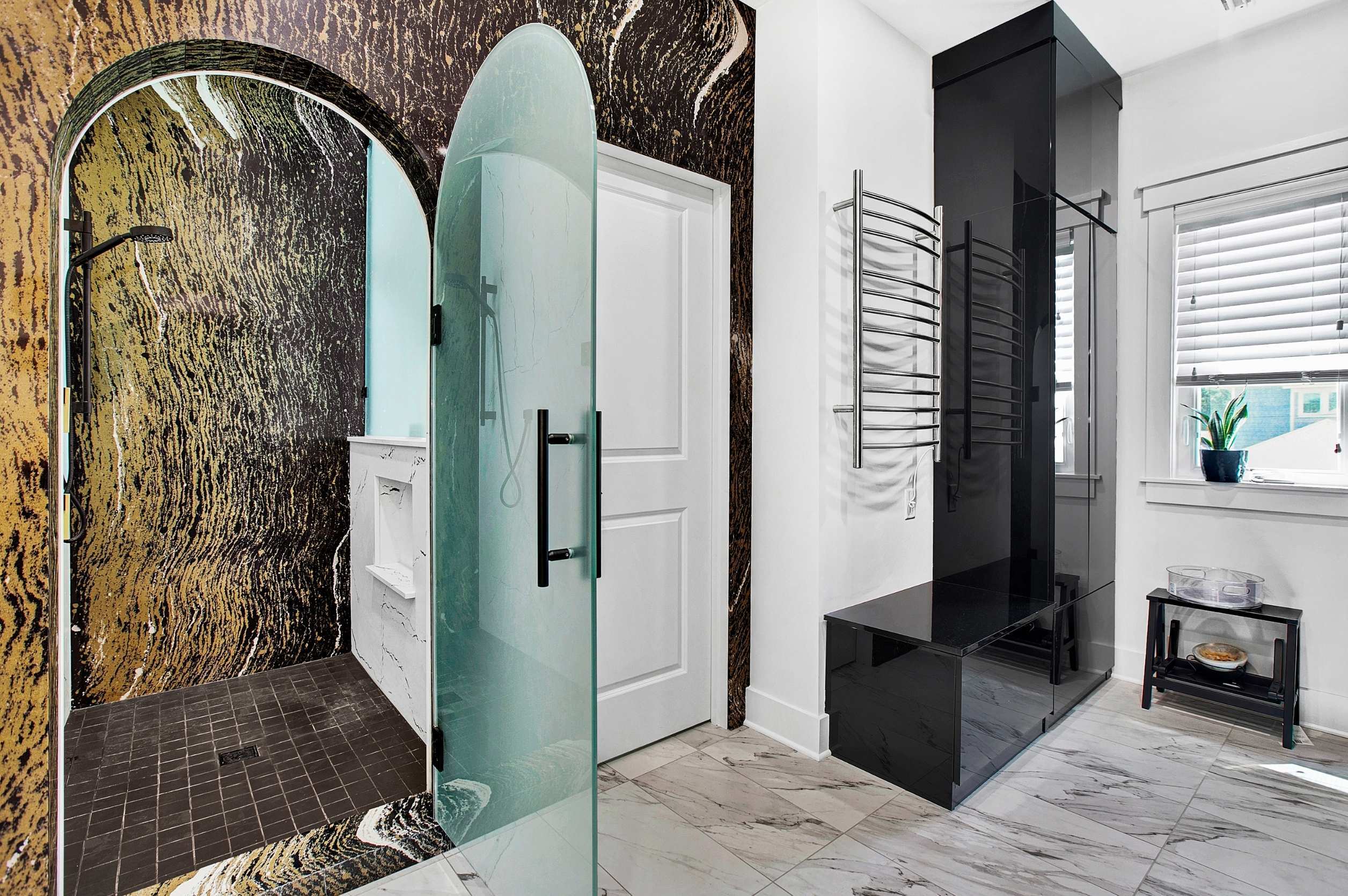 luxury remodel in jacksonville, fl with dark tile and glass door walk in shower