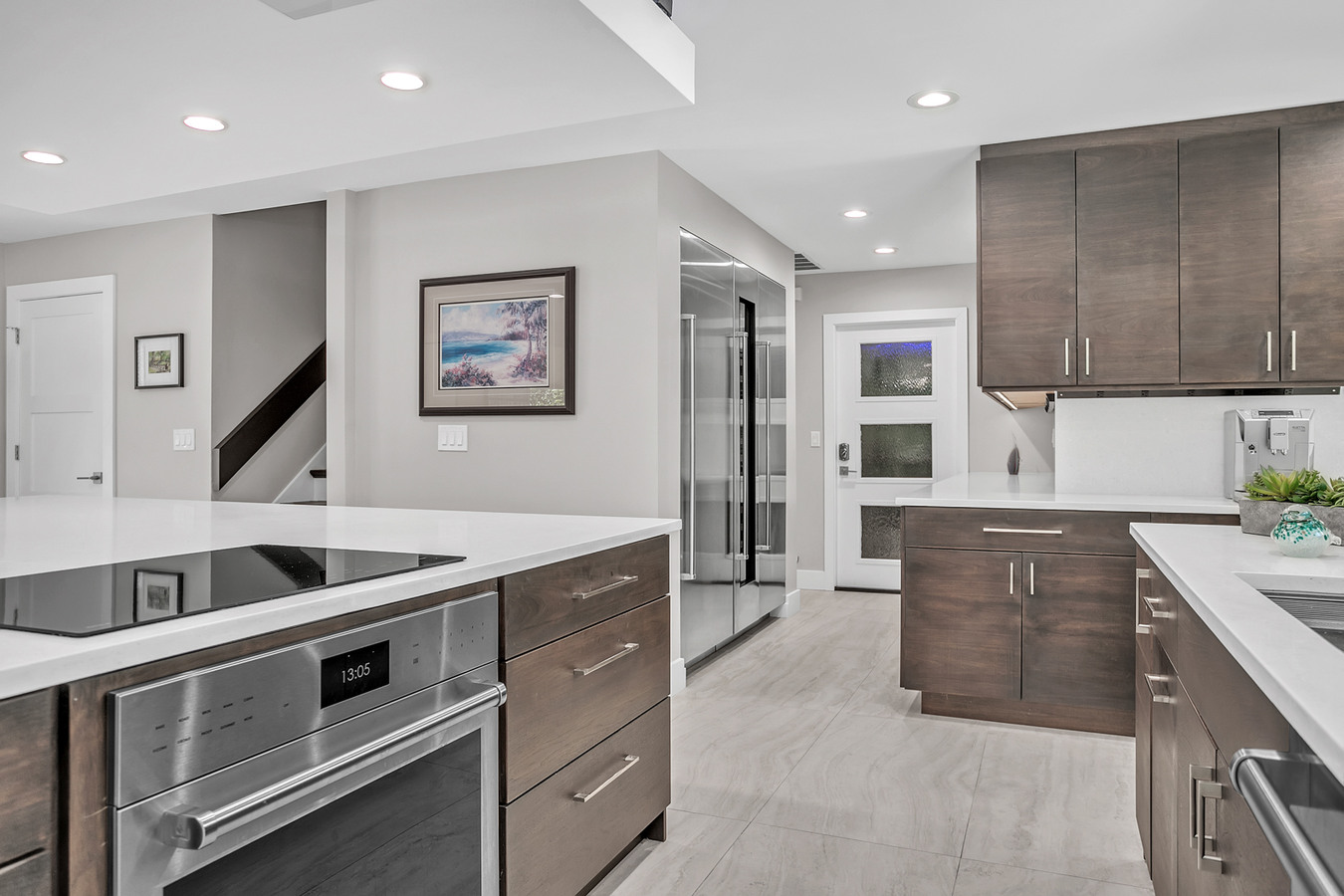 Kitchen island with built-in stovetop in BeeTree Homes custom home in Jacksonville
