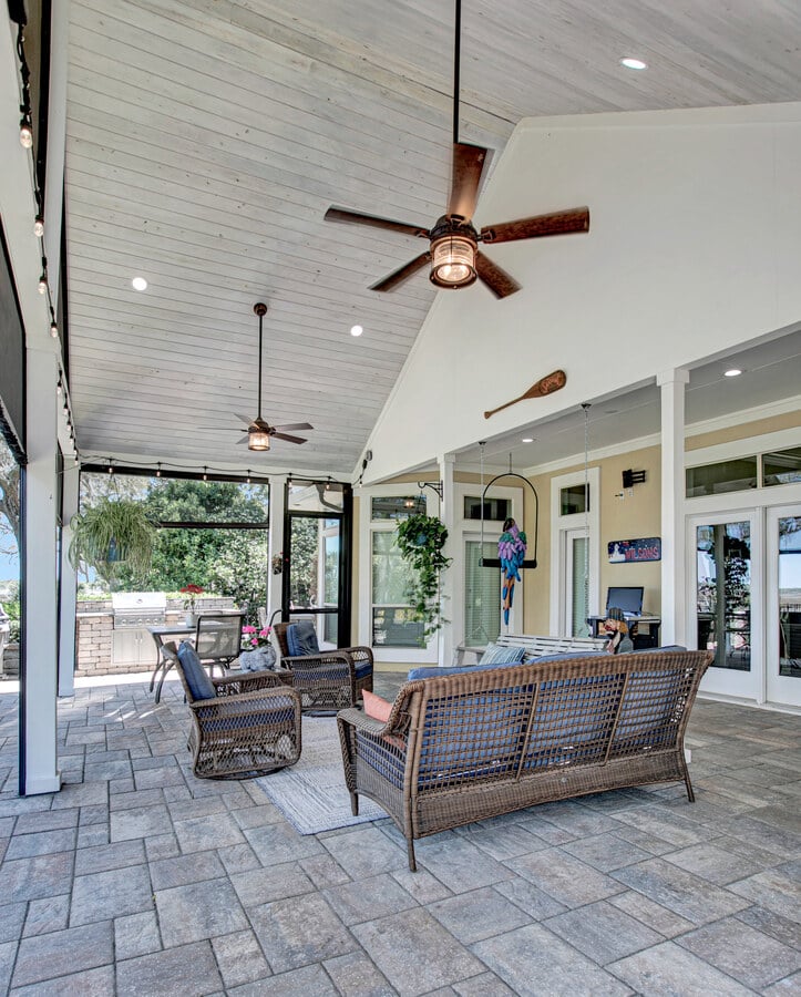 High ceiling screened patio with outdoor fans in BeeTree Homes Jacksonville custom home
