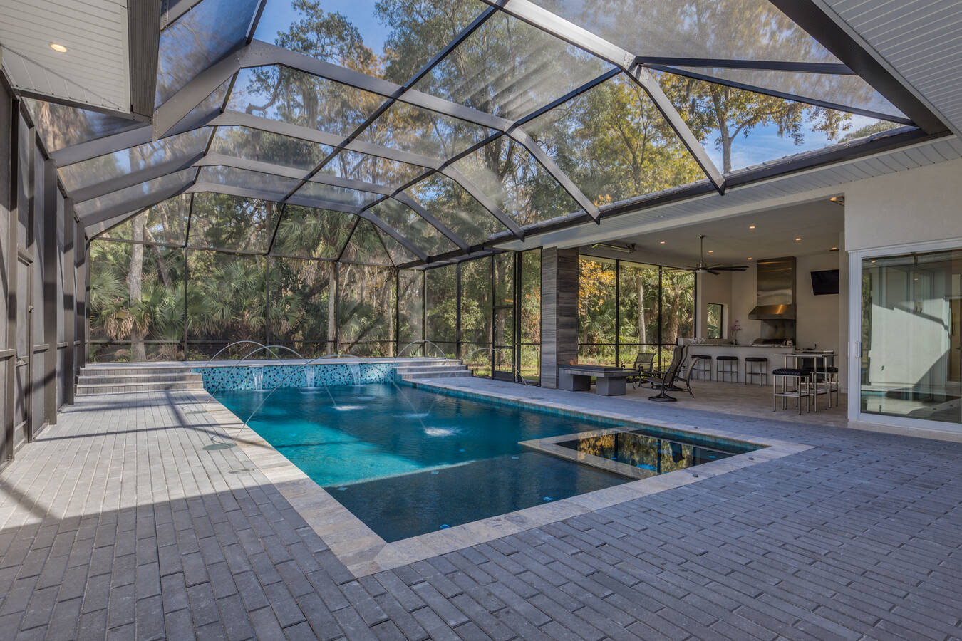 Custom pool and outdoor kitchen combo in Jacksonville, FL by BeeTree Homes