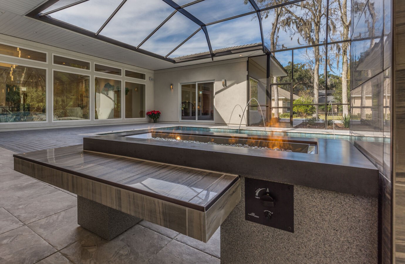 Custom-built patio firepit with modern design by BeeTree Homes in Jacksonville, FL