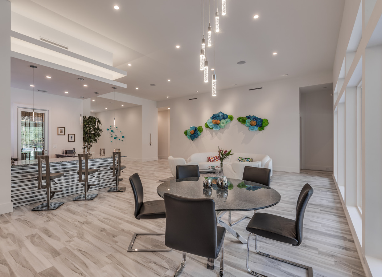 Modern open-concept living and dining area in Jacksonville custom home by BeeTree Homes