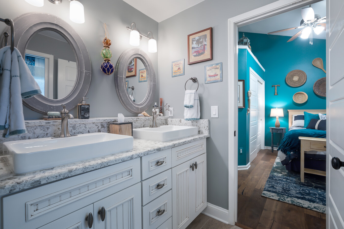 Stylish bathroom design with vessel sinks and blue bedroom view in Jacksonville by BeeTree Homes